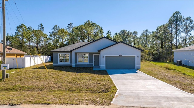 single story home featuring a garage, central air condition unit, and a front yard