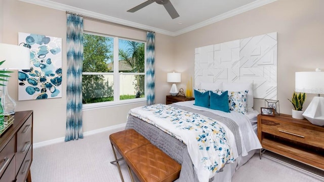 bedroom featuring ceiling fan, crown molding, and light carpet