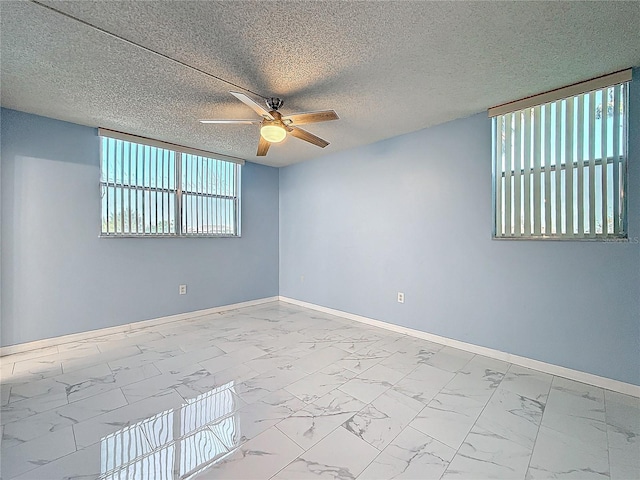 unfurnished room featuring a textured ceiling and ceiling fan