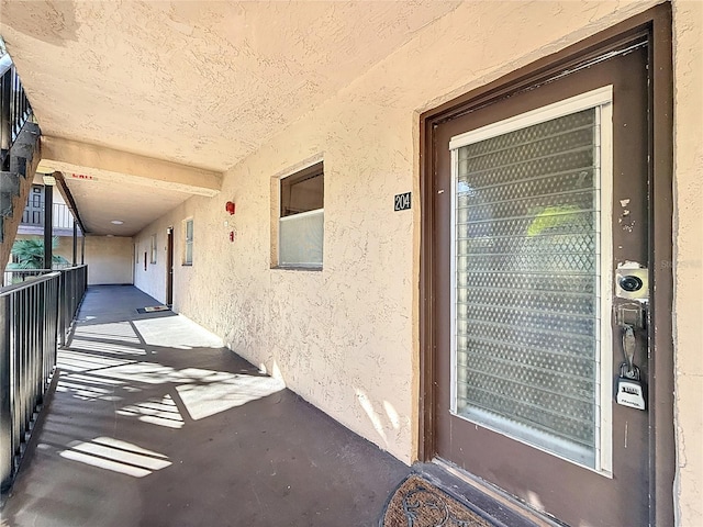 doorway to property featuring a balcony