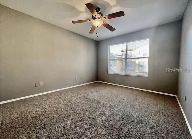 unfurnished room with carpet flooring and ceiling fan