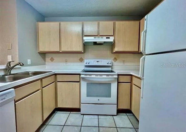 kitchen featuring backsplash, white appliances, sink, and light tile patterned floors