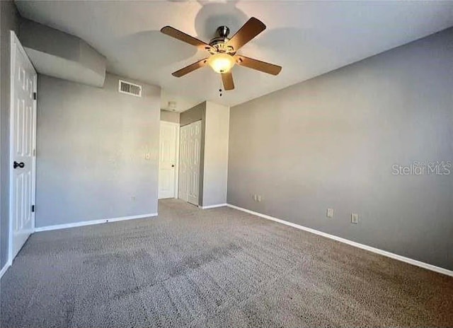 carpeted empty room with ceiling fan