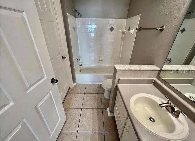 full bathroom with tile patterned flooring, vanity, toilet, and tub / shower combination