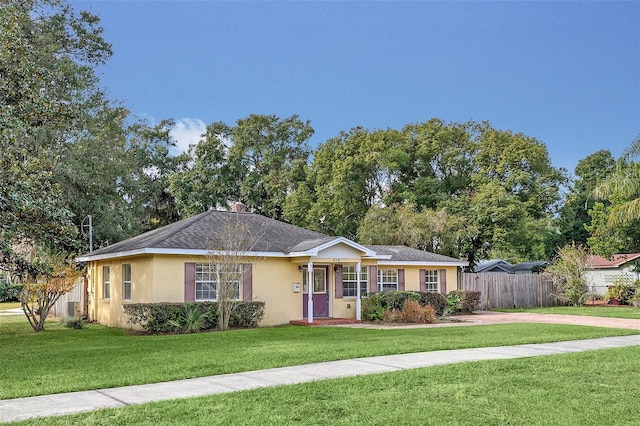 ranch-style house featuring a front lawn