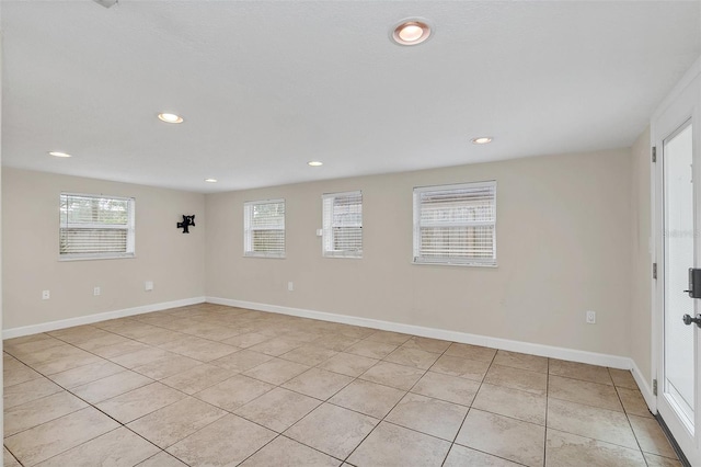 empty room with light tile patterned floors