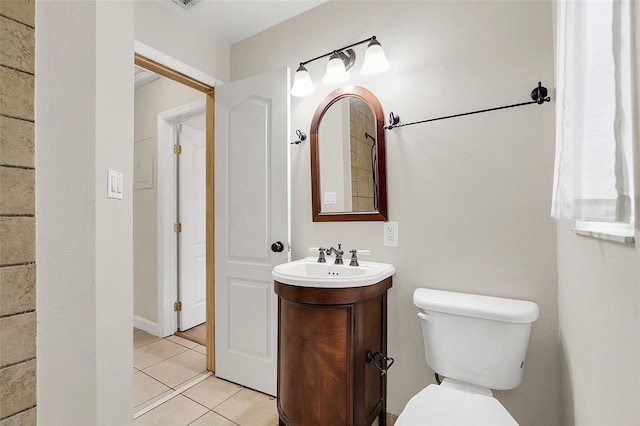 bathroom with tile patterned floors, vanity, and toilet