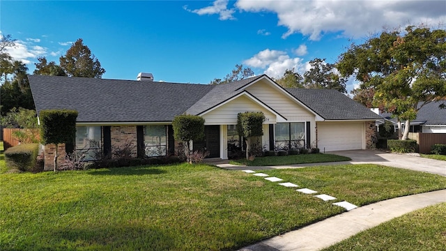 single story home featuring a front yard and a garage