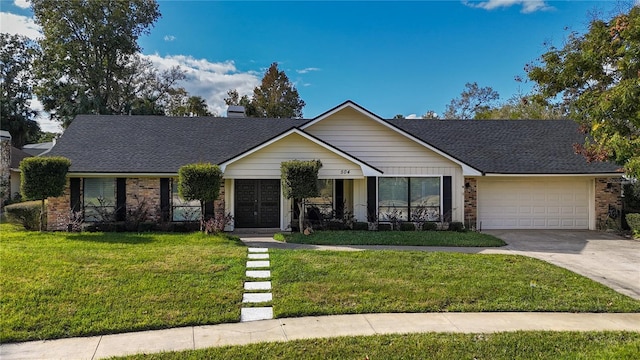 ranch-style house featuring a porch, a front yard, and a garage