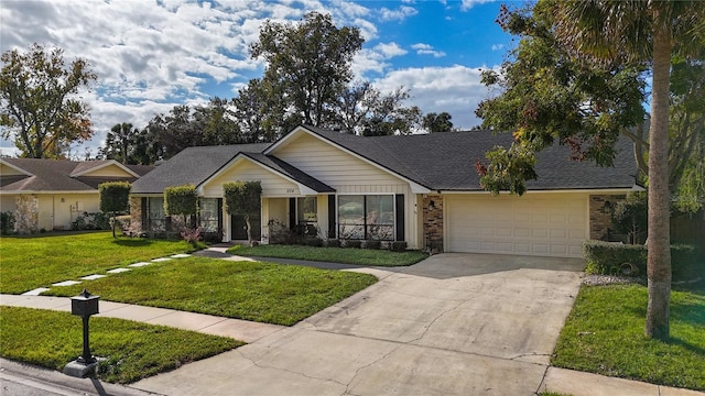 single story home with a garage and a front lawn