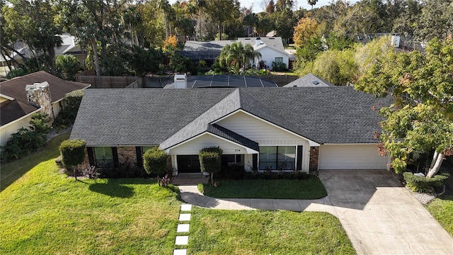 ranch-style house with a lanai, a garage, and a front yard