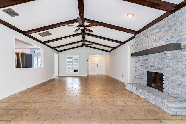 unfurnished living room with a fireplace, lofted ceiling with beams, ceiling fan, and light tile patterned flooring