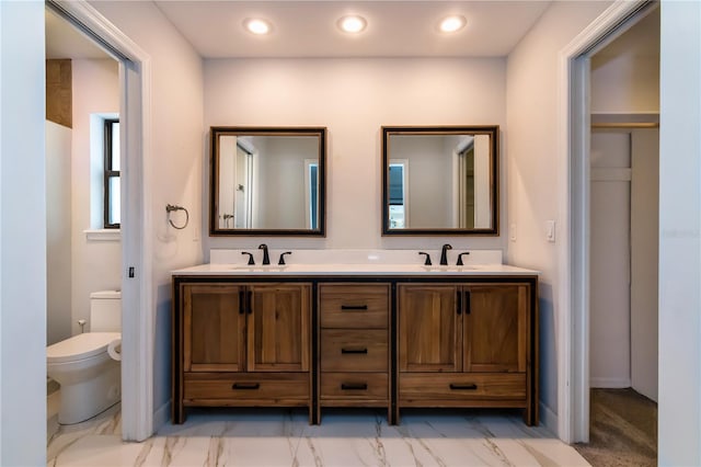 bathroom with vanity and toilet