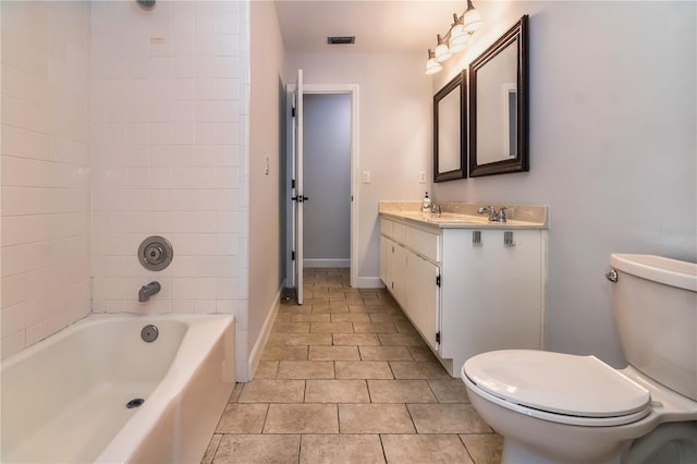 full bathroom featuring vanity, toilet, and tiled shower / bath combo