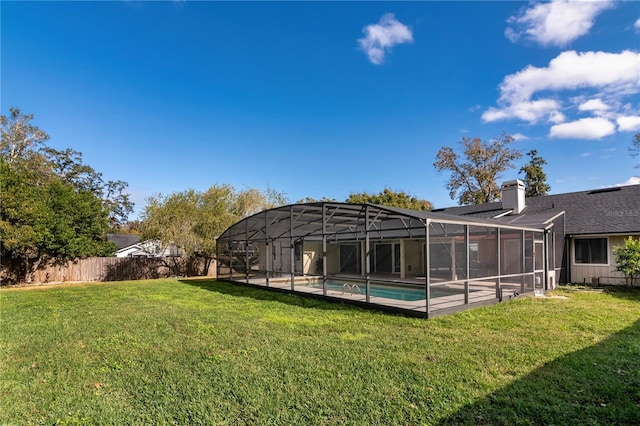 view of yard with a fenced in pool and a lanai