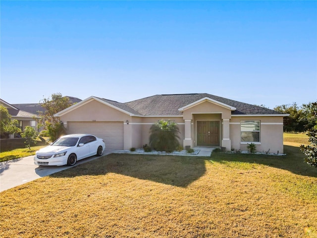 single story home featuring a garage and a front yard