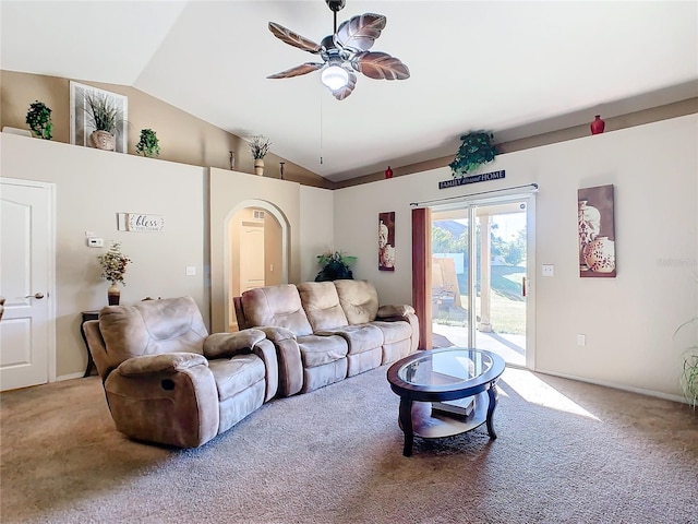 living room with ceiling fan, carpet floors, and vaulted ceiling