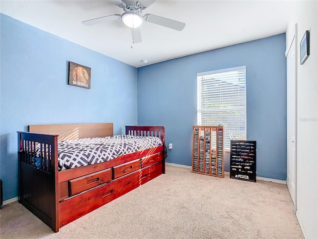 carpeted bedroom featuring ceiling fan