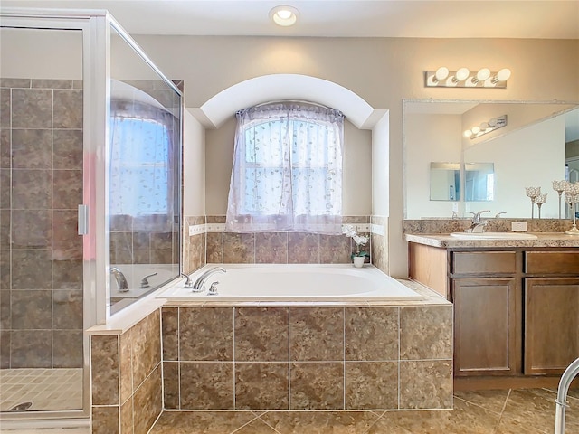 bathroom featuring separate shower and tub, tile patterned flooring, and vanity