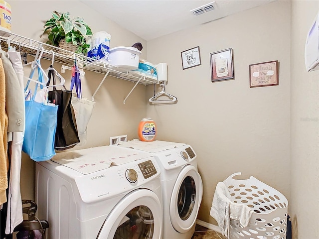 washroom with separate washer and dryer