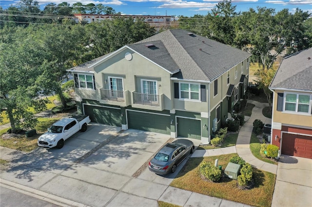 view of front of house with a balcony and a garage