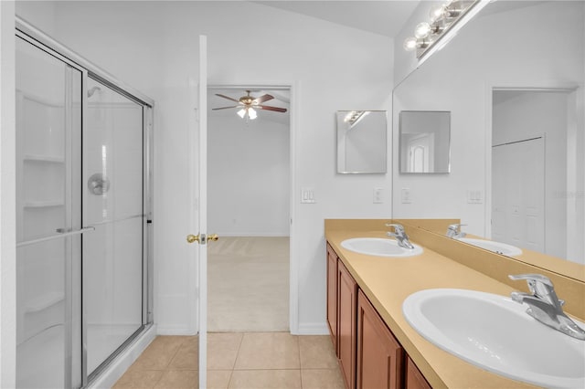 bathroom with walk in shower, vanity, ceiling fan, tile patterned flooring, and lofted ceiling