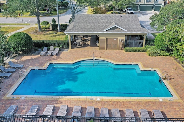 view of swimming pool with a patio