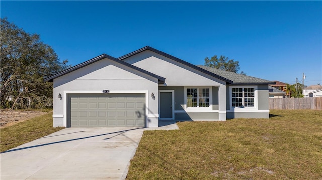 single story home featuring a front yard and a garage