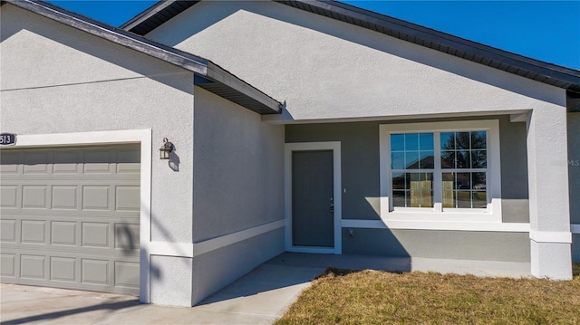 entrance to property featuring a garage