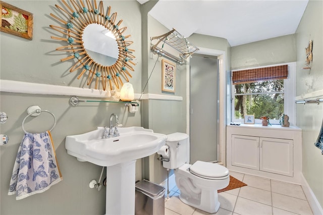 bathroom with tile patterned floors, sink, and toilet