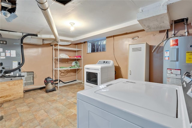 clothes washing area with washing machine and dryer and electric water heater