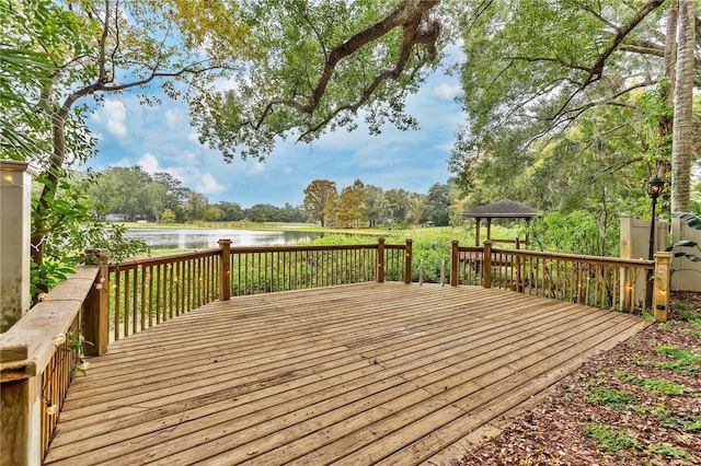 deck featuring a gazebo and a water view