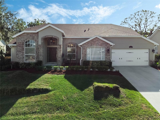 single story home with a garage and a front lawn