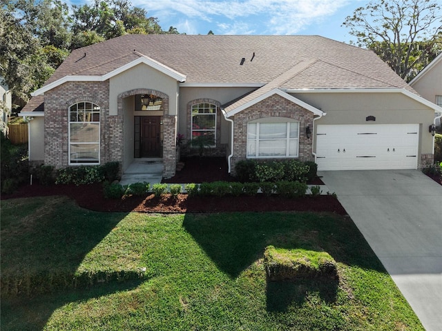 view of front of house featuring a front yard and a garage