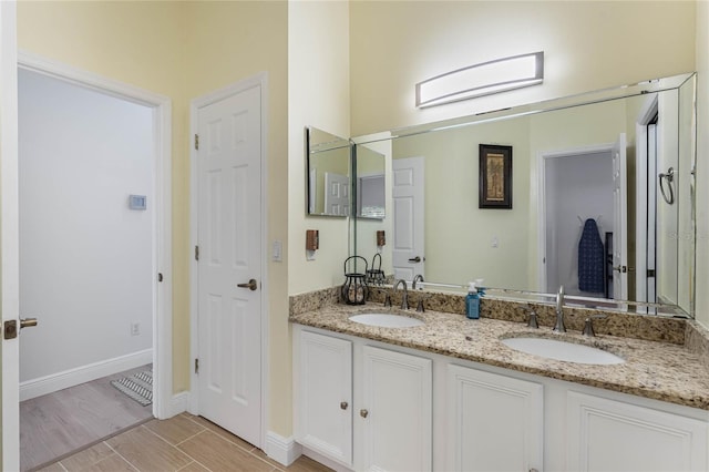 bathroom with wood-type flooring and vanity