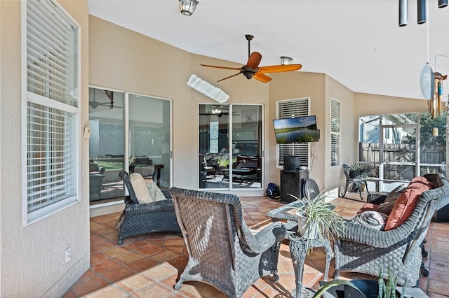 view of patio featuring ceiling fan