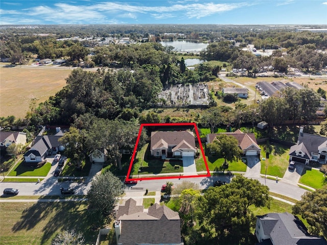 birds eye view of property featuring a water view