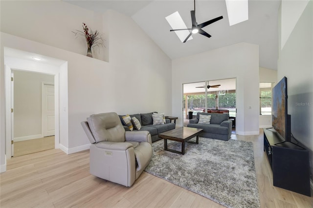 2226 Lake Marion Dr, Apopka, FL 32712 - living area with a skylight, high vaulted ceiling, a ceiling fan, and light wood-type flooring