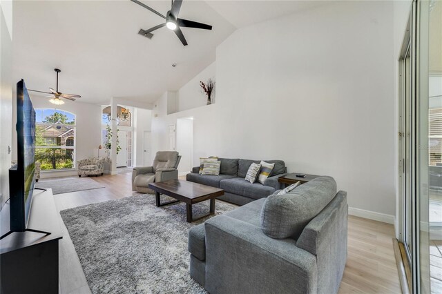 2226 Lake Marion Dr, Apopka, FL 32712 - living area with visible vents, baseboards, high vaulted ceiling, light wood-type flooring, and a ceiling fan