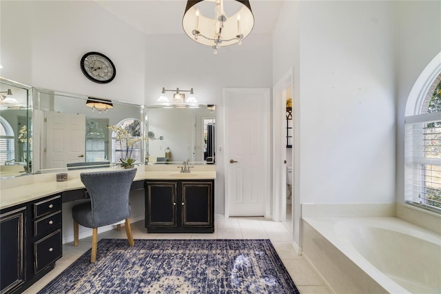 2226 Lake Marion Dr, Apopka, FL 32712 - bathroom with a bath, tile patterned floors, vanity, a chandelier, and a high ceiling