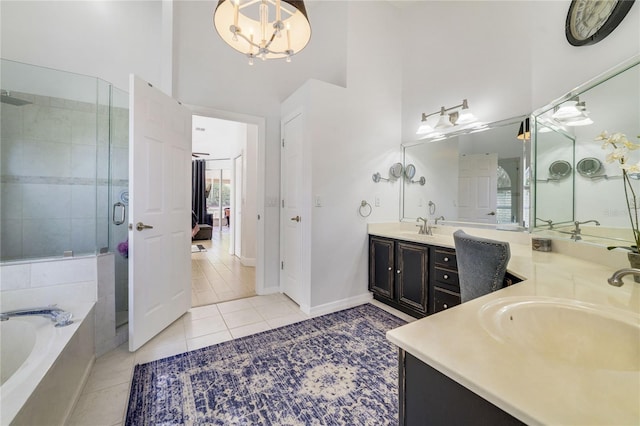 2226 Lake Marion Dr, Apopka, FL 32712 - bathroom featuring double vanity, a bath, a shower stall, a sink, and a high ceiling