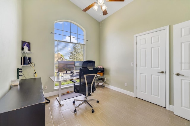 2226 Lake Marion Dr, Apopka, FL 32712 - office area with light wood-style flooring, ceiling fan, baseboards, and high vaulted ceiling