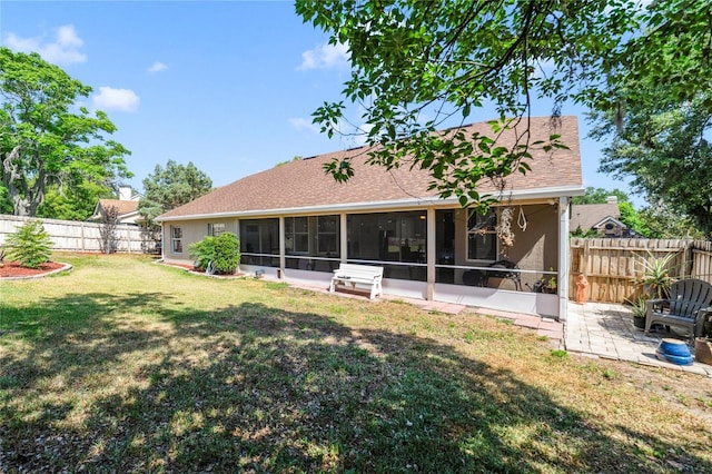 2226 Lake Marion Dr, Apopka, FL 32712 - rear view of property with roof with shingles, a sunroom, a fenced backyard, a patio area, and a yard
