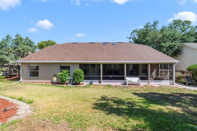 2226 Lake Marion Dr, Apopka, FL 32712 - rear view of house with a lawn, fence, a sunroom, and roof with shingles
