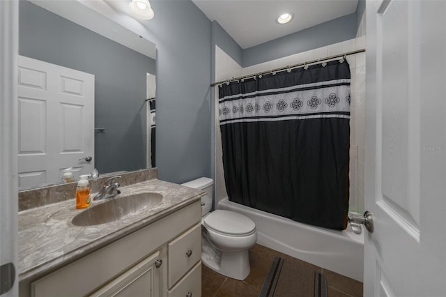 full bathroom featuring tile patterned flooring, vanity, toilet, and shower / bathtub combination with curtain