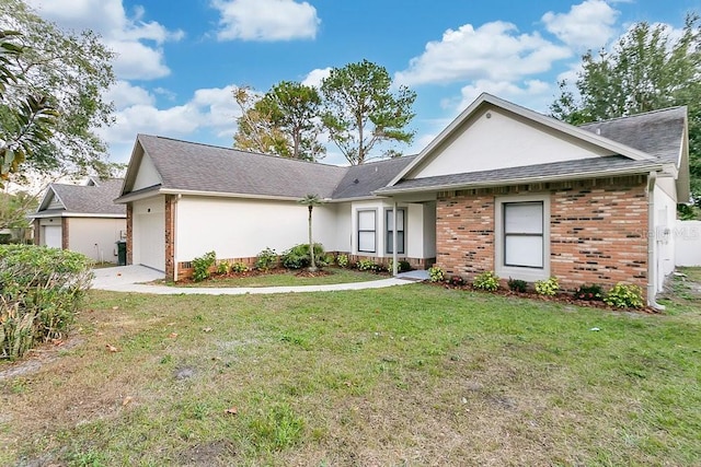 ranch-style home with a front yard and a garage