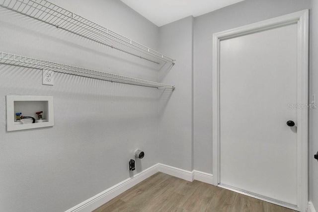 laundry room with hookup for a washing machine and wood-type flooring