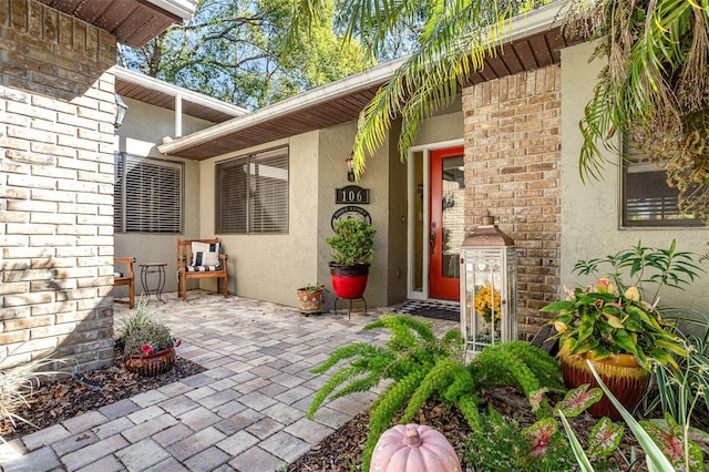 entrance to property featuring a patio area