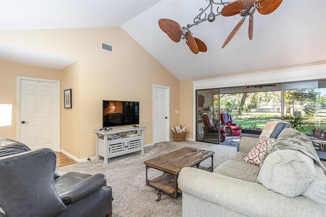 carpeted living room featuring ceiling fan and lofted ceiling