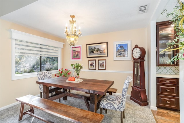 dining space with a notable chandelier